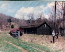 Oil24 "Another view of lower power house. The power was an early (1800s) McEwen Bros. Engine built in Wellsville. Dad converted it to electric by pulling one flywheel...