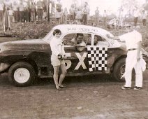 Sportsman's Raceway - Ulysses PA 014 Unknown (young lady) presenter, to Bud Perkins (driver) and Whitey Roboski looks on.