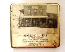 MDRayStore-Allentownc1930s M.D.Ray Store-c.1930's (Tin Box, Advertising Piece) Shows old Hardware, formerly Brandon's & later Williams Store; Cemetery in background to left.