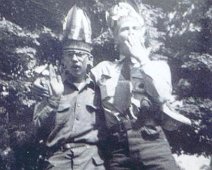 Canoe05 (L->R) Bill McQueen & Ward Guild after buying Indian headdress at Niagara Falls just prior to crossover into Canada.