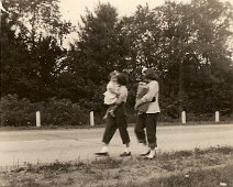 31-Unknown-Sloan Per Don Adams, "one girl is Beverly Sloan". (Believed to be Beverly on the right carrying the bag of groceries.) Girl on left carrying the young girl is...