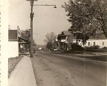 32-Allentown Main St 1950's ca. photo, taken from in front of the Adams family home. At left, Harris Supply, oilfield suppy company. Building burned about 2011. At right, across NY...