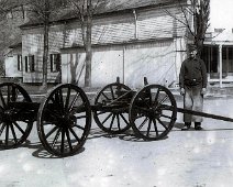 Hyland Chassie in Front of Blacksmith "The above ' two for the price of one' photo shows two men, one of them Tim Hyland, with a Hyland Chassis or 'Truck', which he built in Angelica. The picture...