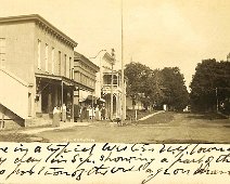 33_Kellogg-Rushford Scene is a typical Western N.Y. town on a lazy day in Sep. Showing a part of the business portion of the village Main St. Addressed to Allan Gilbert Ithaca NY...