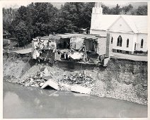 ChurchParishHallHangingByThread Lutheran Church Parish Hall clings to the bank in broken form; The Church building itself has a weakened foundation which cracked and proved unsafe. Photo by...