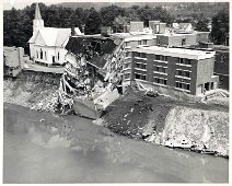 ChurchandHospitalClingingToLife With damage to Hospital, Church Parish Hall, and the Church Building unstable, they cling to the bank for life. Photo by Dick Neal