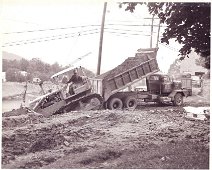 FillForRiverbank-AtPearlSt The tedious job of filling the riverbank back....near Pearl Street and Hospital. Photo by Dick Neal