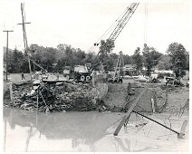 FormerlyPearlStBridge-InRiver A battle lost!! Pearl Street Bridge lies in the bottom of the river, the casualty of Hurricane Agnes. Photo by Dick Neal