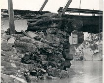 HospitalGone-BridgeGoing Visible beneath the bridge, the hospital is collapsed and the bridge abutment is decayed and ready to Photo by Dick Neal