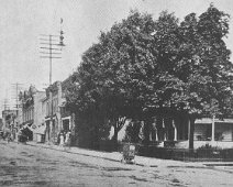 McCarty-Macken House2 Much earlier view of the corner and Macken Home. Viewing unpaved Main Street leads us to believe this photo dates prior to 1901. (-photo from postcard printed...