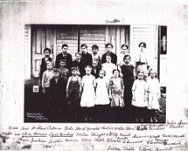 Wellsville NY District 7 Students 1914 Back Row - Willard Adams, Arlo Mead, Harold Howland, Willie Adams?, Fred [?], Ruth Burdick, Julia Grow, Teacher. Middle Row - Charles Downer, Carl Burdick,...