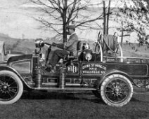 2ndTruck-DykeStHoseCo-pumper A.W.Corwin at the wheel of the second truck, a hi-pressure pumper acquired by the Dyke Street Company. From Pennysaver 