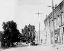 E-Pearl St-c1921 View of East Pearl Street from Main St. intersection, loaned by Diane Converso, Wlsv Town Historian. Bldg at right is former Hardware now Optician Bldg. 2nd on...