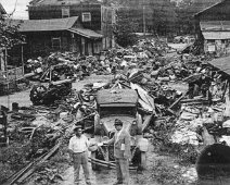 Junk Jamboree-Abe Grossman-SMainSt World War II "Junk Jamboree" showing junk & scrap collected for the war effort. Abe Grossman (left) shown handing a check to Dick Embser for proceeds from sale...