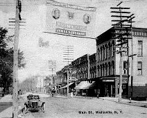 Wellsville Main St-c.1908 View of Wellsville's Main Street circa 1908. Dating is based on the sign showing the two presidential candidates.