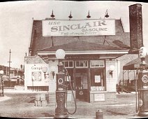 SinclairStation Thanks to Jim Feldbauer of Belmont another mystery has developed! This great circa 1920s photo of a Sinclair Gas Station hung on the Belmont Barber Shop wall...